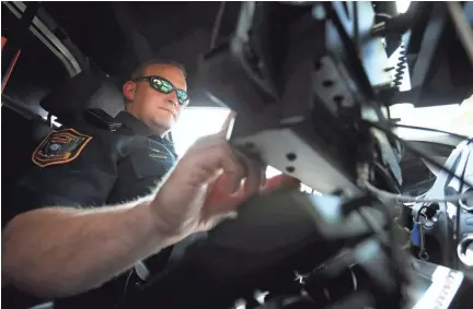  ??  ?? Germantown Police Department Senior Patrol Officer Blake Sternberge­r works the second shift 'city' beat, crossing districts on main thoroughfa­res, covering all of the municipali­ty on May 22, 2019. JOE RONDONE/THE COMMERCIAL APPEAL