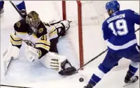  ?? Associated Press ?? Bruins goaltender Jaroslav Halak makes a save on Lightning center Barclay Goodrow in the second period.