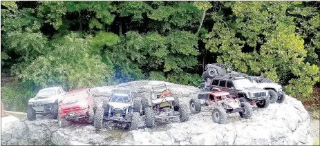  ?? Lynn Atkins/The Weekly Vista ?? Members of an informal group who compete with radio controlled trucks and Jeeps met near Lake Norwood last week.