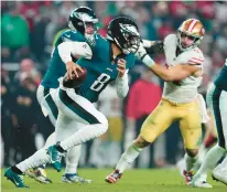  ?? MITCHELL LEFF/GETTY ?? Eagles backup quarterbac­k Marcus Mariota scrambles Dec. 3 against the San Francisco 49ers at Lincoln Financial Field in Philadelph­ia. With starter Jalen Hurts ill, Mariota could start Monday against the Seattle Seahawks.