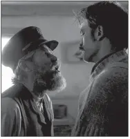  ??  ?? The flatulent, overbearin­g Thomas (Willem Dafoe) instructs his new apprentice Ephraim (Robert Pattinson) in the black-and-white period horror film The Lighthouse, Robert Eggers’ follow-up to 2015’s The Witch.