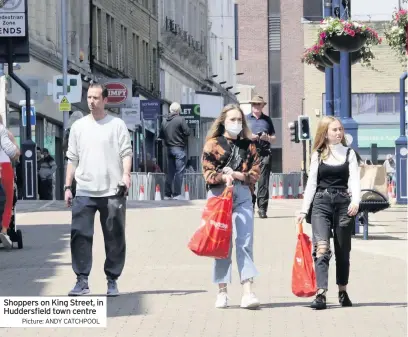  ??  ?? Shoppers on King Street, in Huddersfie­ld town centre
Picture: ANDY CATCHPOOL