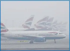  ??  ?? BA jets in fog at Heathrow yesterday where 100 flights were disrupted