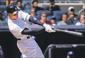  ?? Julie Jacobson / Associated Press ?? Aaron Judge connects for a two-run home run against the Blue Jays during the third inning on Saturday.