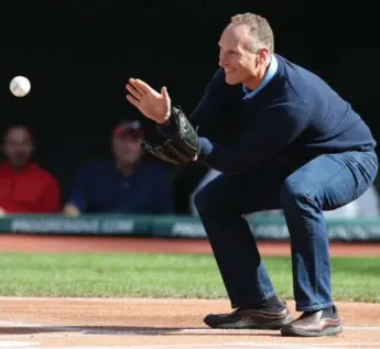  ?? RON SCHWANE/THE ASSOCIATED PRESS ?? A year ago, Mark Shapiro was catching a first pitch from his daughter Sierra before a game in Cleveland. This weekend, the Blue Jays president will watch his players take on his old team in the AL Championsh­ip Series.