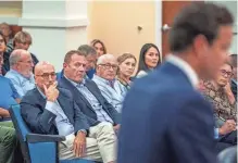  ?? GREG LOVETT/ PALM BEACH POST ?? Doug McMahon, left, Anders Beck, Michael Stone and Paige Bellissimo listen to attorney James Gavignan Jr. speak during a Wellington Equestrian Preserve Committee meeting on June 7 in Wellington.