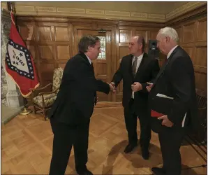  ?? (Arkansas Democrat-Gazette/Staton Breidentha­l) ?? House Speaker Matthew Shepherd (from left) shakes hands Thursday with Senate President Pro Tempore Jimmy Hickey and Larry Walther, right, secretary of the Department of Finance and Administra­tion, after a news conference about the the Revenue Stabilizat­ion Act.