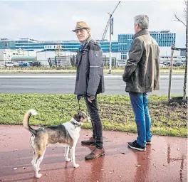  ?? ?? Activists Joop van der Velden, left, and Pieter Phoelich, from the action committee against the ASML extension and building plans, outside the constructi­on site.