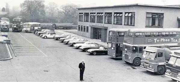  ??  ?? Sir William Lyons stands at his factory in Browns Lane, Coventry in May 1962 with the full range of Daimler, Jaguar and Guy vehicles