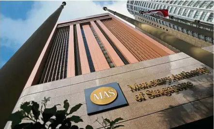  ??  ?? Network tie-up: The Monetary Authority of Singapore and the Bank of Thailand are exploring the possibilit­y of a link between the two countries’ digital-payment platforms. — Reuters