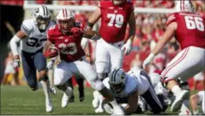  ?? MORRY GASH — THE ASSOCIATED PRESS FILE ?? Wisconsin’s Jonathan Taylor runs against BYU in September in Madison, Wis. The nation’s leading rusher is headed back east when the Badgers face No. 21 Penn State on Saturday.