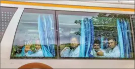  ?? PTI ?? Rajasthan CM Ashok Gehlot, Congress leaders and MLAS board a bus towards a hotel after a meeting at CM residence, in Jaipur, on Monday