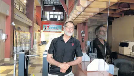  ?? GREG MCNEIL/CAPE BRETON POST ?? Andre Gallant, CEO of YMCA of Cape Breton, stands at the entrance of the Charlotte Street location on Friday where efforts are underway to prepare the facility to reopen.