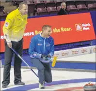  ?? JASON SIMMONDS/JOURNAL PIONEER ?? John Morris yells instructio­ns to his sweeps while opposing skip Jamie Murphy looks on intently. The two teams met in Draw 2 of the 2017 Home Hardware Road to the Roar Pre-Trials curling event at Eastlink Arena on Monday night. Morris prevailed 9-3.