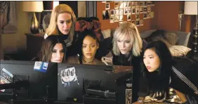  ?? Barry Wetcher / Associated Press ?? From foreground left, Sandra Bullock Sarah Paulson, Rihanna, Cate Blanchett and Awkwafina in a scene from "Ocean's 8."