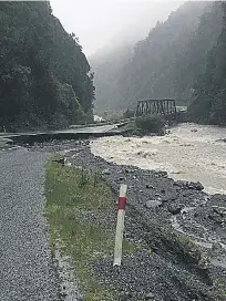  ?? PHOTO: SUPPLIED ?? Closed to traffic . . . A chunk of State Highway 73 has been washed out at Yorkeys Bridge at the bottom of the Otira Gorge.