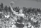  ?? MICHAEL CATERINA/SOUTH BEND (IND.) TRIBUNE ?? Mishawaka's Brady Fisher (23) drives to the basket during the Mishawaka vs. NorthWood boys basketball game on Feb. 9 in Nappanee.