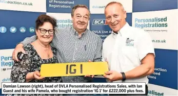  ??  ?? Damian Lawson (right), head of DVLA Personalis­ed Registrati­ons Sales, with Ian Guest and his wife Pamela, who bought registrati­on ‘IG 1’ for £222,000 plus fees.