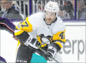  ?? Paul Vernon The Associated Press ?? Forward Adam Johnson had briefs stints with the Pittsburgh Penguins over two seasons, appearing in 13 games in 2019 and 2020. He died Saturday at 29.
