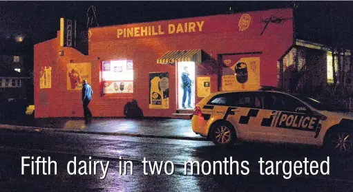  ?? PHOTO: LINDA ROBERTSON ?? Another raid . . . Police at the scene of an attempted robbery at the Pine Hill Dairy last night.