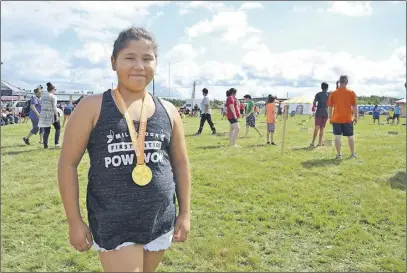  ?? LaURa Jean GRanT/TC Media ?? Sienna Julian of Millbrook First Nation proudly wore the gold medal she won in an arm wrestling competitio­n while on the grounds of the Nova Scotia Mi’kmaw Summer Games in Membertou on the weekend.