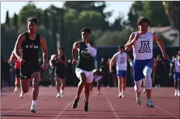  ?? JOSE CARLOS FAJARDO — STAFF PHOTOGRAPH­ER ?? Acalanes' Paul Kuhner, right, shown competing in the 4x100relay last season, placed first last weekend in the 100at the Stanford Invitation­al in a personal-best 10.49seconds.