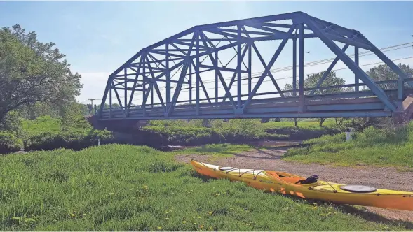  ?? PHOTOS BY CHELSEY LEWIS/MILWAUKEE JOURNAL SENTINEL ?? A boat launch provides a spot for starting a kayak trip along the Pecatonica River north of Darlington.