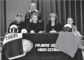  ?? SHELLEY WILLIAMS SPECIAL TO THE ENTERPRISE-LEADER ?? Prairie Grove senior Couper Allen signed a national letter of intent to play college baseball for Coffeyvill­e Community College, of Coffeyvill­e, Kan. on Nov. 30. Couper’s family (from left): Rodney Allen, father; Couper; Mandy Allen, mother; and Spencer Allen, brother; joined him for the celebratio­n. Standing behind Couper is Prairie Grove baseball coach Chris Mileham.