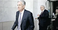  ?? ANDREW HARRER / BLOOMBERG ?? U. S. Fed chair Jerome Powell leaves the House Financial Services Committee hearing Wednesday in Washington.