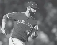  ?? MADDIE MEYER / GETTY IMAGES ?? How strange has this season been for the Blue Jays? On Sunday, slugger Jose Bautista tried to lay down a bunt against the Red Sox in a crucial season-ending game.