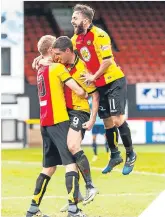  ??  ?? ■ Doolan (centre) celebrates his first goal with Erskine and Lawless.