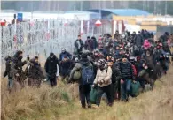  ?? ?? Flashpoint...migrants gather at Belarus boundary