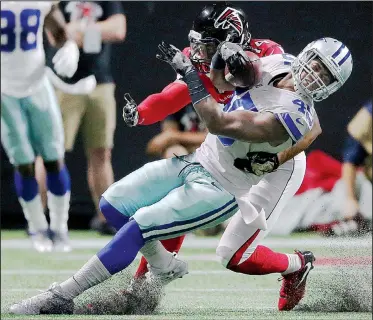  ?? AP/JOHN BAZEMORE ?? Rod Smith (45) is hit by Falcons linebacker Vic Beasley during the first half Sunday in Atlanta. The Falcons won 27-7 for only their second victory since Week 3.