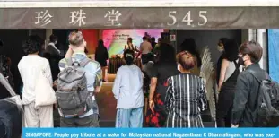  ?? ?? SINGAPORE: People pay tribute at a wake for Malaysian national Nagaenthra­n K Dharmaling­am, who was executed for traffickin­g heroin into Singapore, during a memorial service in Singapore. — AFP