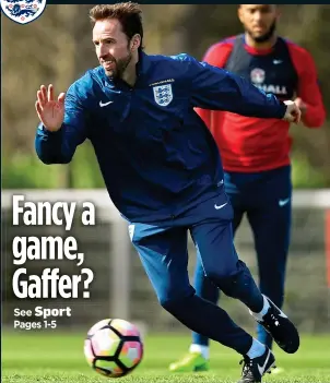 ??  ?? THE OLD ROUTINE: England manager Gareth Southgate showed all his old skills in training yesterday as his players prepared for today’s key clash with Lithuania