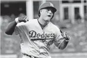  ?? [AP PHOTO] ?? Los Angeles Dodgers’ Manny Machado celebrates his three-run homer against the Atlanta Braves during the seventh inning in Game 4 of a National League Division Series on Monday in Atlanta.