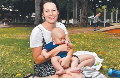  ??  ?? North Shore resident Sarah Geale with Simeon, four months, relaxing on The Strand.
Picture: ALIX SWEENEY