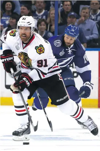  ?? GETTY IMAGES ?? Brad Richards of the Chicago Blackhawks skates with the puck during Game 1 of the Stanley Cup Final against the Tampa Bay Lightning. Richards played with the Lightning during their Cup run of 2004.