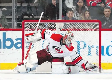  ?? ELSA/ GETTY IMAGES ?? Goaltender Eddie Lack will get an opportunit­y to resurrect his career with the Calgary Flames next season after being acquired from the Carolina Hurricanes. Lack has struggled the past couple of seasons with the Hurricanes.