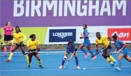  ?? PTI ?? India's Tete Salima, centre, takes control of the ball during the Women's Pool A hockey match between India and Ghana at the Commonweal­th Games in Birmingham, England, Friday