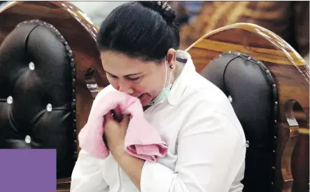  ?? BINSAR BAKKARA/THE ASSOCIATED PRESS/FILES ?? Ethnic Chinese woman Meiliana reacts during her sentencing hearing at a district court in Medan, North Sumatra, Indonesia last month for blasphemy.