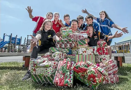  ?? ANDY JACKSON/STUFF ?? Bell Block School’s student council raised $800 to buy Christmas presents for underprivi­leged children.