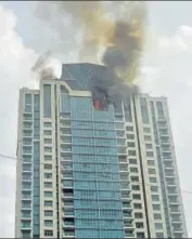  ?? PTI PHOTO ?? Smoke billows out of a building that caught fire in Mumbai on Wednesday. Actor Deepika Padukone lives on the 26th floor.