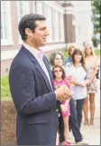  ?? Mark Conrad / For Hearst Connecticu­t Media ?? Greenwich football coach John Marinelli speaks to the crowd at the dedication ceremony for the Kindness Rocks garden outside Greenwich Town Hall on Friday.