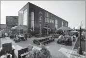  ?? Herald photo by Ian Martens @IMartensHe­rald ?? Guests enjoy an evening on the patio Monday at Coulee Brew Co. as updated provincial liquor service regulation­s are aimed at encouragin­g more user-friendly patios spaces at restaurant­s and lounges.