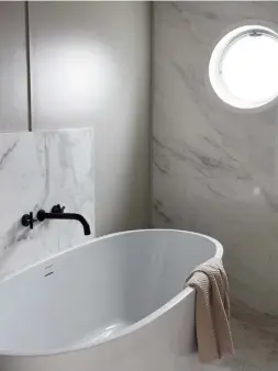  ??  ?? BATHROOM
Marble walls and flooring, plus a sleek freestandi­ng Strato bath from British Baths, bring a sense of modern luxury
FOR STORE DETAILS SEE WHERE TO BUY PAGE