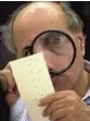  ?? ALAN DIAZ/AP FILE ?? Judge Robert Rosenberg examines a disputed election ballot in Broward County Nov. 24, 2000.