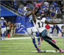  ?? PAUL SANCYA — THE ASSOCIATED PRESS ?? Detroit Lions cornerback Darius Slay (23) intercepts a pass intended for Philadelph­ia Eagles wide receiver Nelson Agholor (17) in the fourth quarter of an NFL football game, Sunday in Detroit. Detroit defeated Philadelph­ia 24-23.