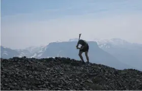  ?? HANDOUT PHOTO BY ALEX WILSON ?? A researcher conducts geological field sampling on Little Ring Mountain, a B.C. volcano that erupted beneath the Cordillera­n Ice Sheet 50,000 years ago.