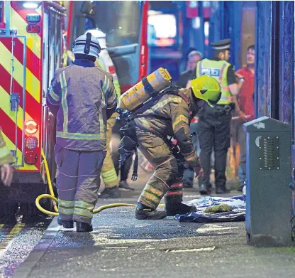  ??  ?? Firefighte­rs and police in St Catherines Square, Perth, after the incident on November 18.